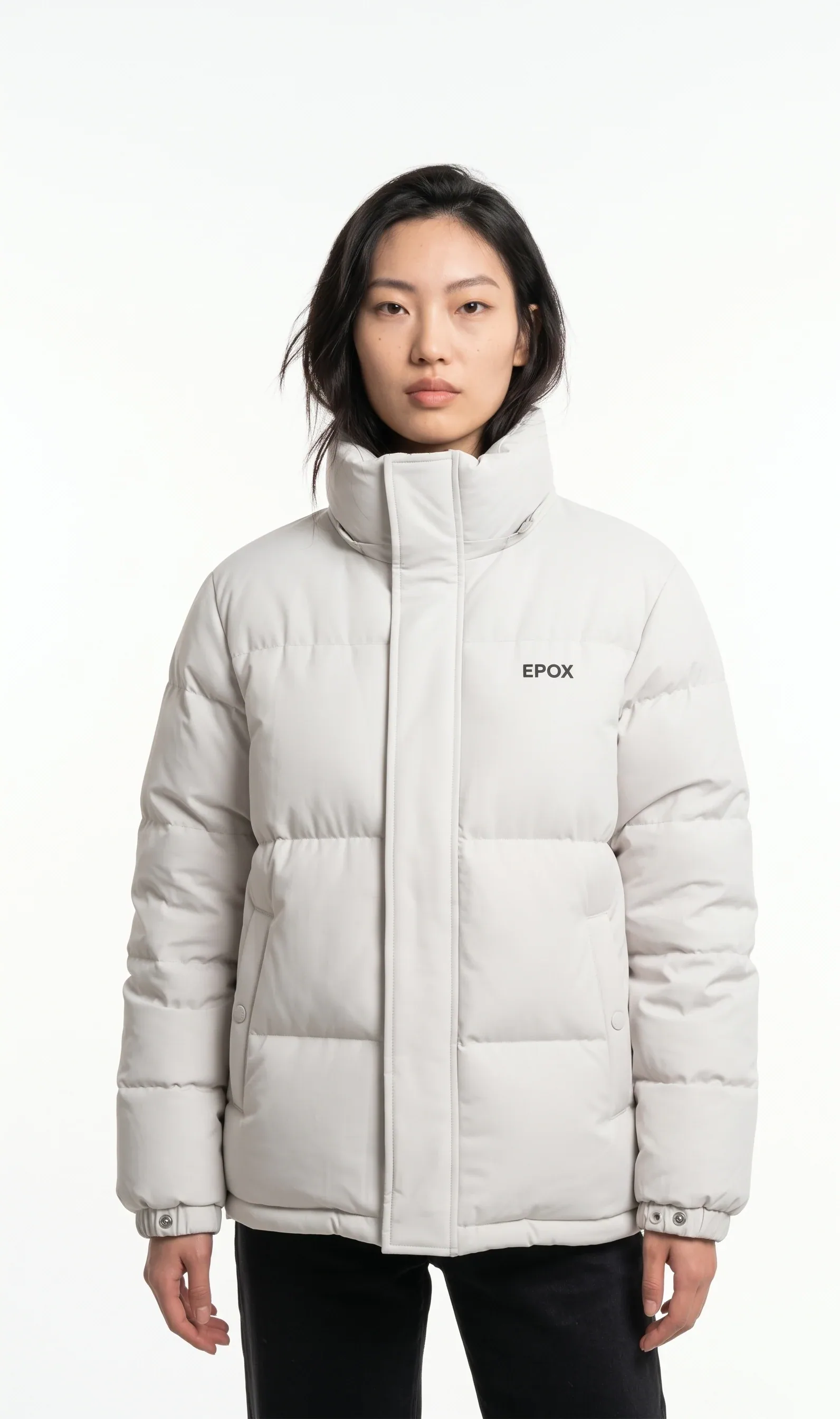 Cream puffer jacket on a model — studio on-model shot