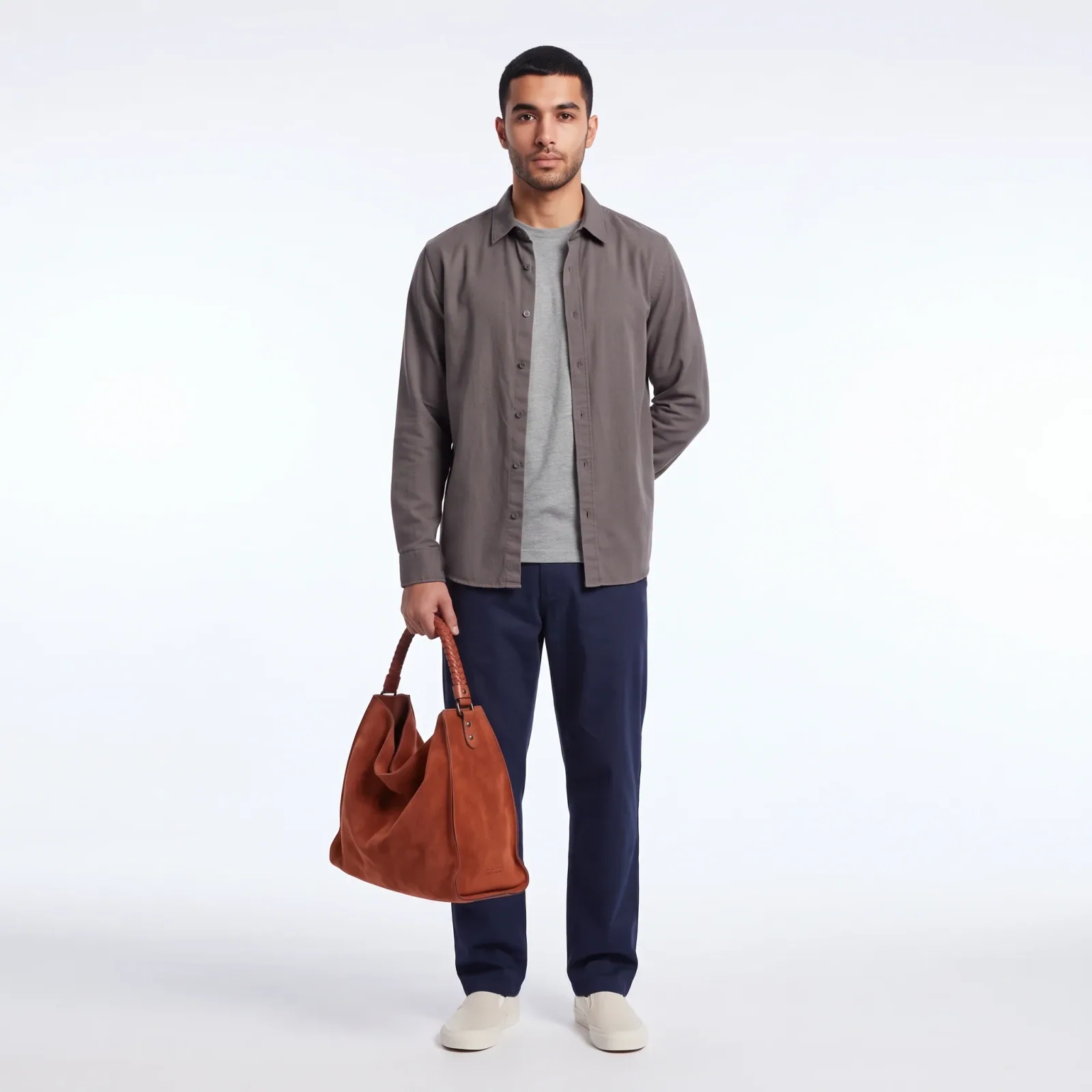 Tan suede tote carried by a model — studio on-model shot