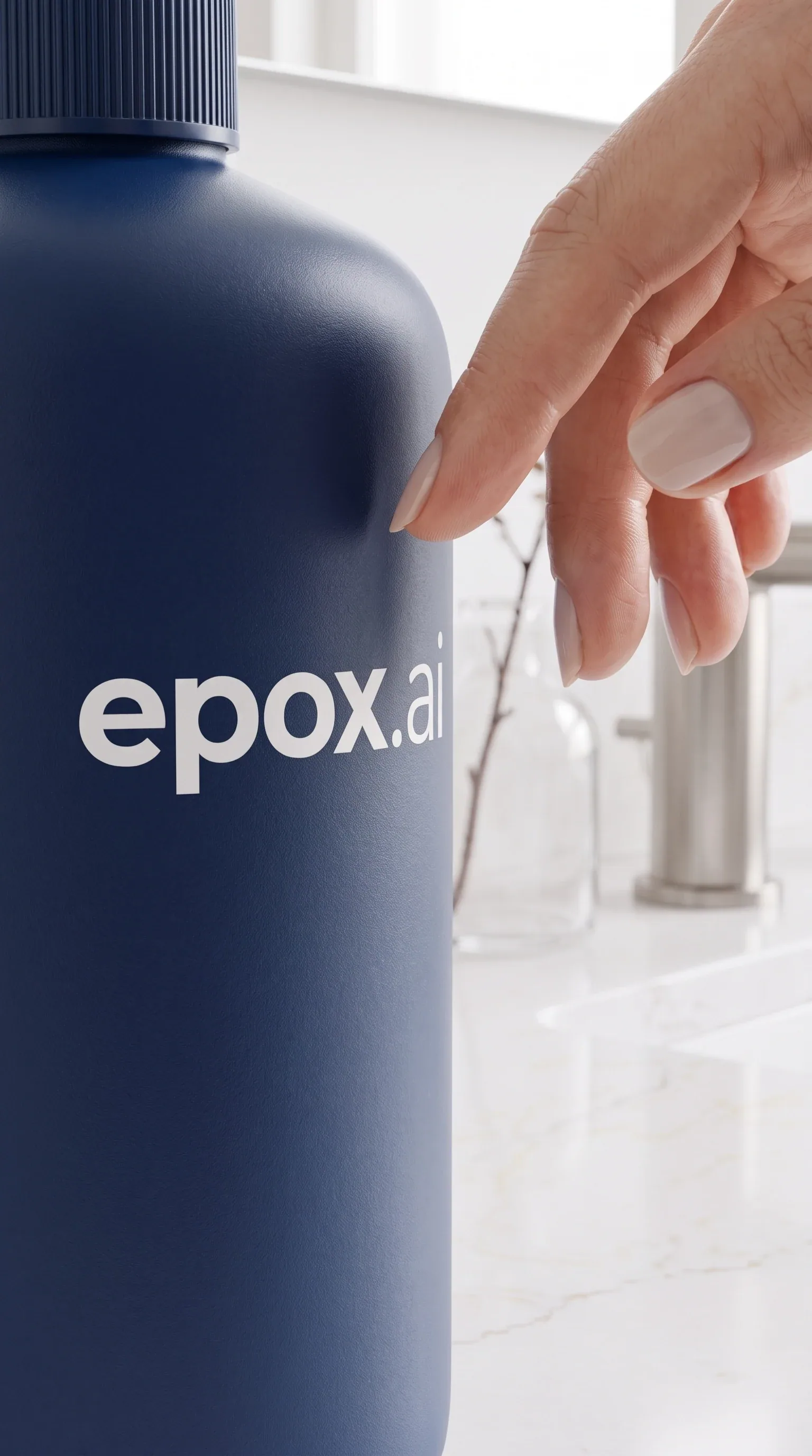 A hand reaching for a navy lotion pump in a bathroom — scene